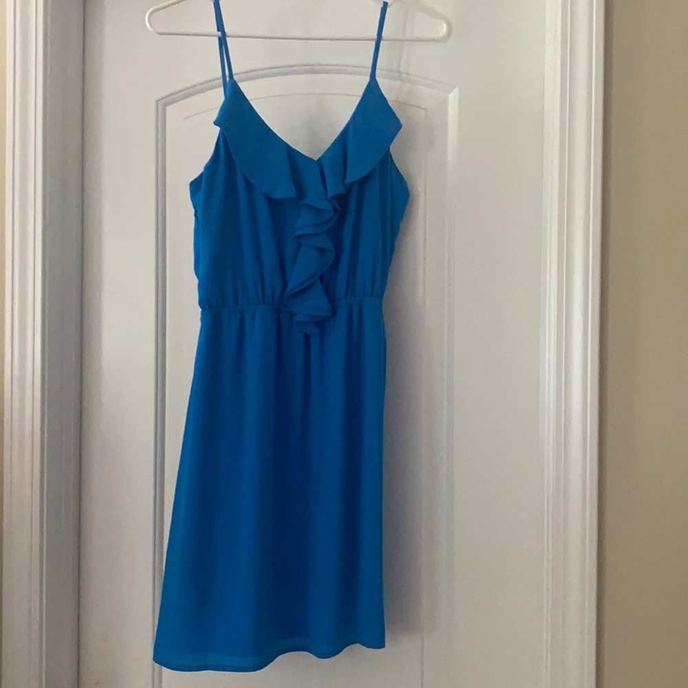 Royal blue spaghetti strap dress. Ruffle too detail and elastic waist.